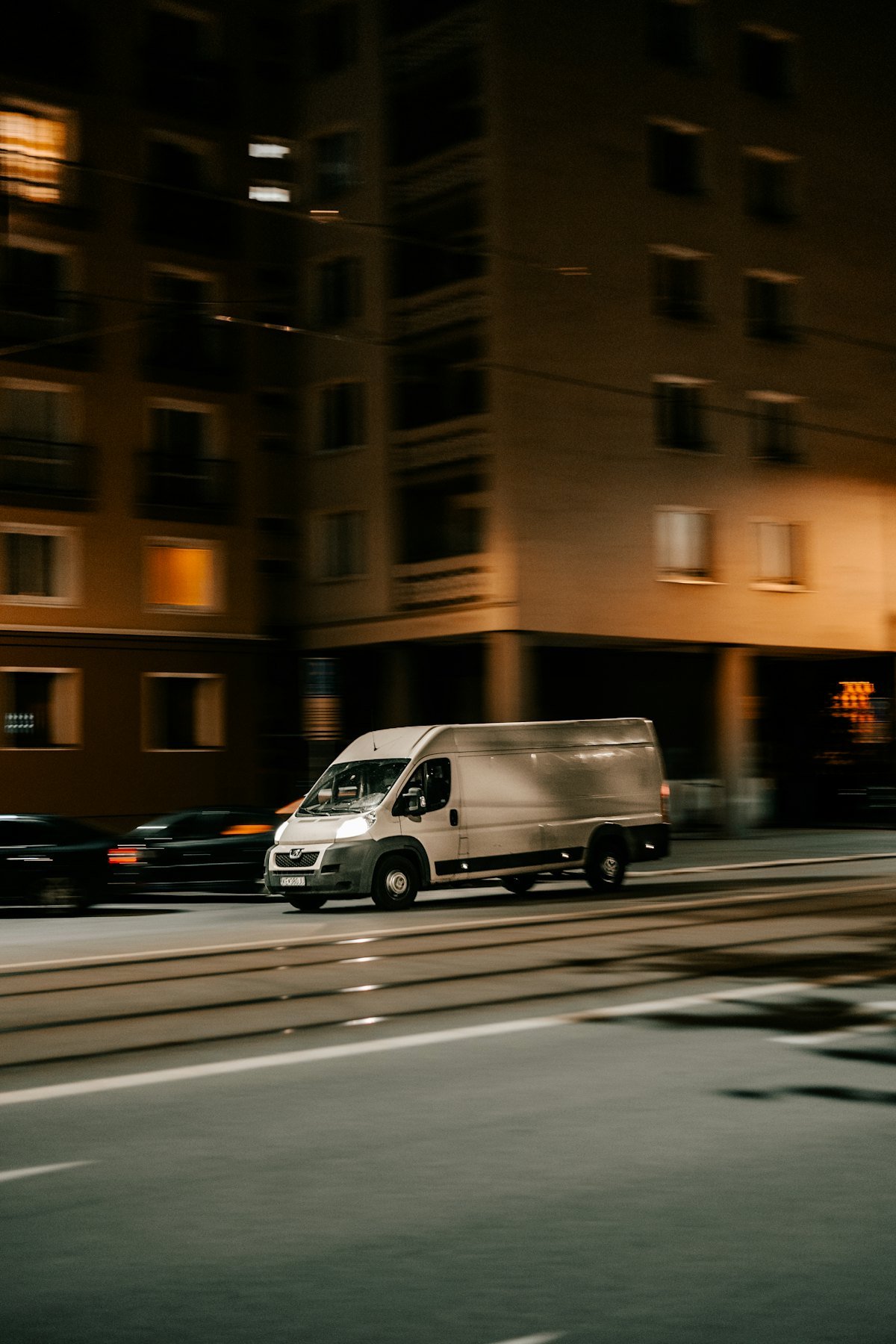 Courier van on a direct drive through the city at night